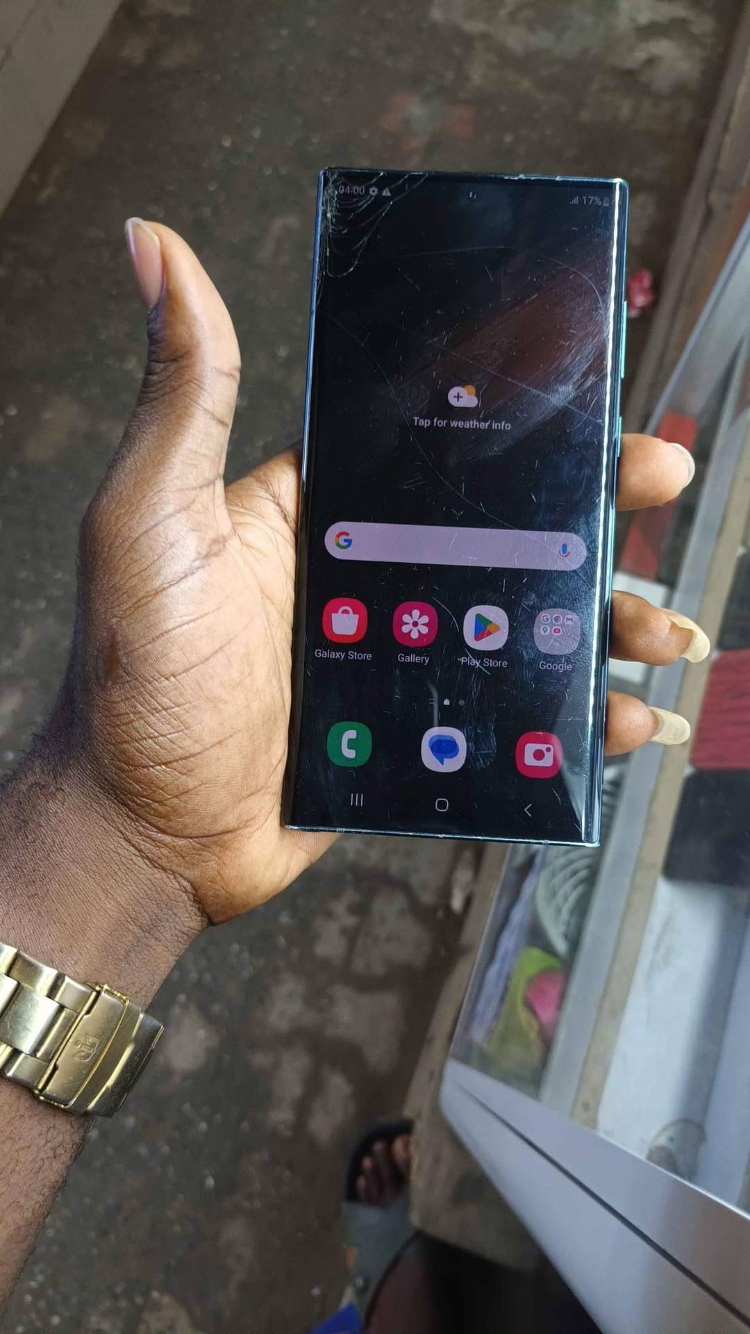 A picture of Samsung s22 ultra slight cracked screen at the top left