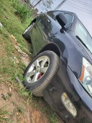 A picture of Lexus rx330 black with black interior Pure first body pan
