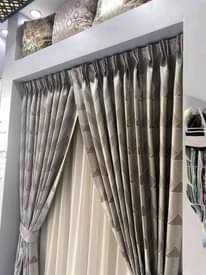 A picture of curtains and rods