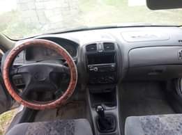 A picture of Mazda 323 4 sale Clean body and clean Interior Sound