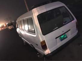 A picture of A White vannet Bus With Diesel engine