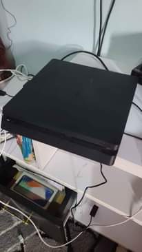 A picture of PlayStation 4 slim 1 terabyte 1 controller 0703 398500