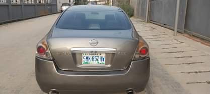 A picture of Neatly used Nissan Altima Bearly driven Thumb start Painted on