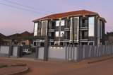 A picture of  Apartment Block For Sale Location Kyanja Kungu on tarmac.