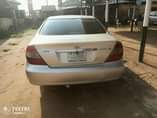 A picture of Toyota Camry 2003 LE First Body Bumper Painted 4 Plugs