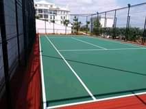 A picture of Tar surfaces and Tennis court