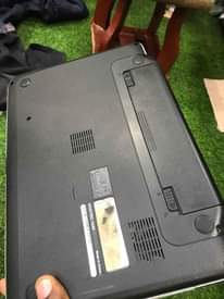 A picture of Dell vostro 1440core i3 imenyooka kila kitu lipia TSH 245