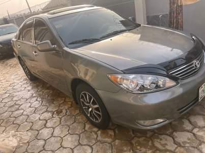 A picture of Delay is dangerous 2004 Toyota Camry big daddy Painted on