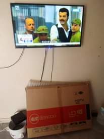 A picture of Lshaped chairs and TV