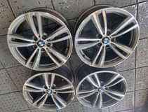 A picture of 19 ORIGINAL BMW MAGS WIDE AND NARROW. MAGS ARE IN