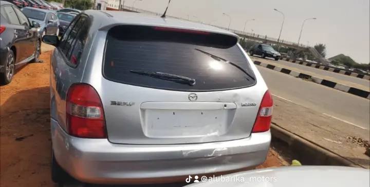 A picture of Direct Tokunbo Mazda 323f with factory filted a c with