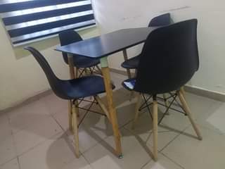 A picture of Dinning table and modem for sale