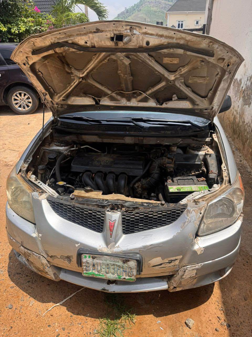 A picture of Distress Toyota poitac vibes 2005 model with.. Untampered engine Untamp