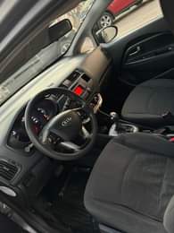 A picture of NEATLY USED 2012 MANUAL KIA RIO Features Neat Leather seats