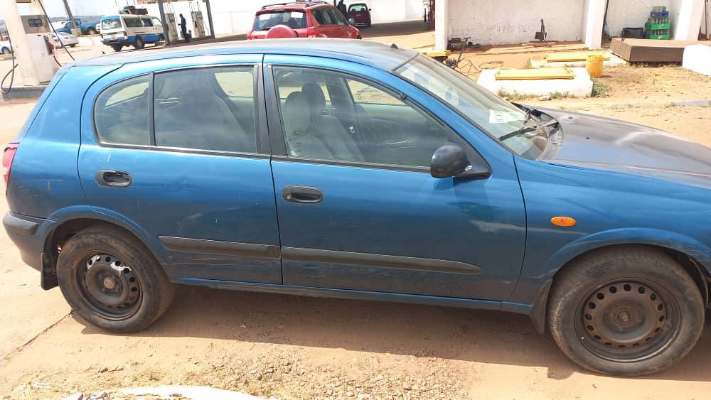 A picture of Nissan Almira Lift Back 2003 Model First Body 4plugs Engine