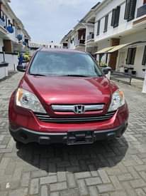 A picture of A Red Honda CR V Jeep.