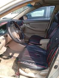 A picture of 2005 Corolla with android screen with pano roof buy and