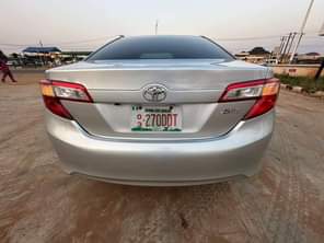 A picture of 2014 model Toyota Camry LE Available Four plugs engine full