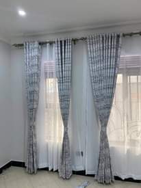 A picture of Curtains nets blinds and rods