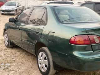 A picture of Extremely clean Toyota Corolla small but mighty With Sound Engine