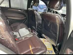 A picture of Mercedes Benz ML 350 2014 model white color black interior