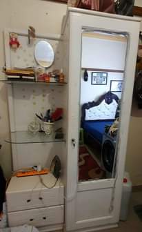 A picture of Bed matress and dressing mirror