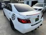 A picture of FOREIGN USED TOYOTA CAMRY 2011 Model Interior Clean 2023 headlight