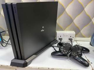 A picture of PS4pro 1tb storage uhd 4k with 5games on storage with