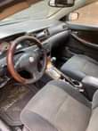 A picture of Toyota Corolla Engine tapping at the top but hardly you