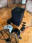 A picture of XBOX SERIES X. 2Controllers 12 games installed