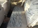 A picture of Clean Mazda 323 2004 model manual Tokunbo standard first body