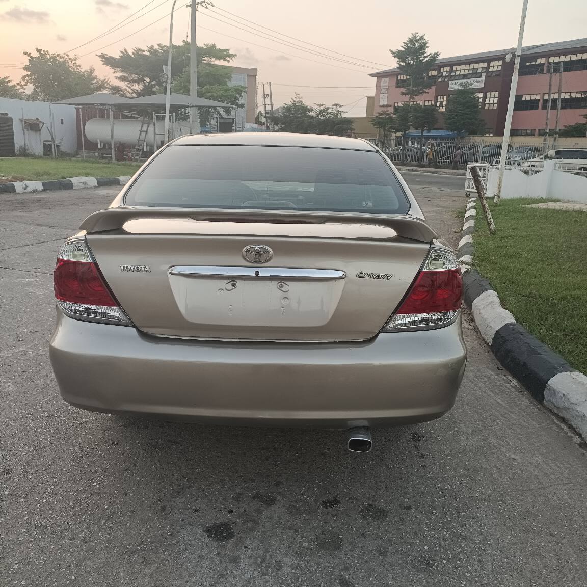 A picture of Toyota Camry 9ja used baked on first body everything is
