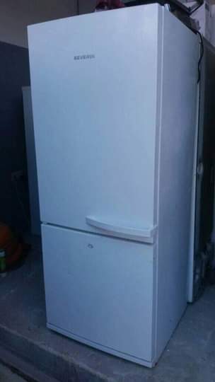 A picture of Fridge freezer and washing machine