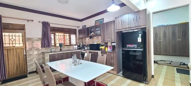 A picture of Namugongo shrine 4bedrooms 4bathrooms 16decimals titled. 4boys quarters all selling