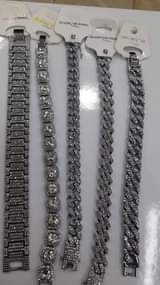 A picture of Iced chains and bracelets