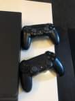 A picture of USED PS4 PRO 1TB WITH 4 PADS AT A GIVEAWAY