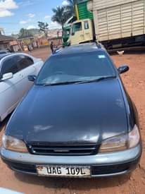 A picture of Car for sale in good condition and busubuzi 5m