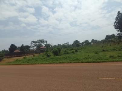 A picture of 100 by 100 ft that touches the tarmac road of