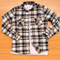 A picture of Original flannel shirts available Call whatsapp 0759636169 Inbox for orders