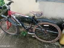 A picture of Used bicycle with 2 bad tyres ND chain 