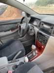 A picture of Sharp Toyota Corolla 2006 on belt