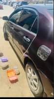 A picture of Total Corolla everything is perfect with Ac chilling Just buy