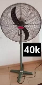 A picture of Haier thamocool 100 liter fridge and ox fan 26 inches