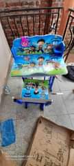 A picture of Kids reading tables