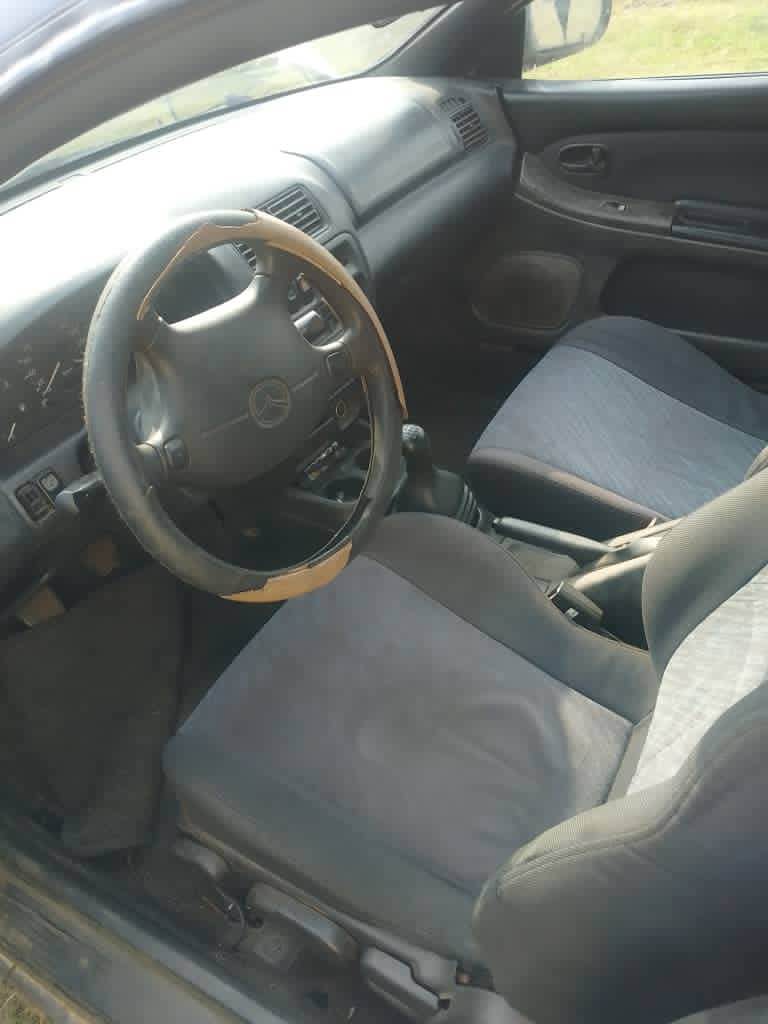 A picture of Mazda 323 in perfect condition 08101444821