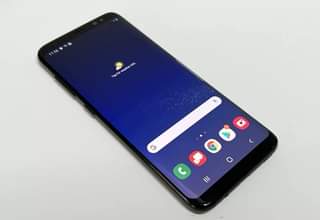 A picture of Sumsung s8 phones available in stock with a charger as