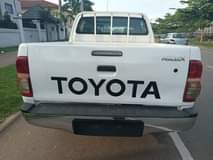 A picture of 2014 manual Toyota hilux with auxiliary gear in Abuja going