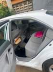 A picture of She Barely drive this car neatly used by a woman