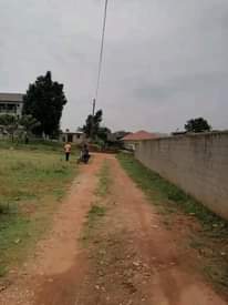 A picture of 50ft X 60ft Prime Commercial Private Land touching tarmac at