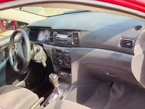 A picture of RED An Extremely Clean Used Toyota Corolla 2004 Model With
